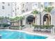 Stunning community pool surrounded by palm trees and upscale building at 700 S Harbour Island Blvd # 731, Tampa, FL 33602