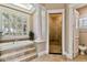 Light and airy bathroom featuring a soaking tub, walk-in shower, and large window at 704 Berrocales De Avila, Tampa, FL 33613