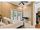 A primary bedroom with a writing desk and walk-out double doors for fresh air at 704 Berrocales De Avila, Tampa, FL 33613