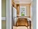Convenient kitchenette featuring stainless steel appliances, granite countertops and ample cabinetry at 704 Berrocales De Avila, Tampa, FL 33613