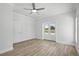 Bright bedroom with ceiling fan, neutral walls, and access to the outside at 718 Desert Hills Way, Sun City Center, FL 33573
