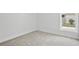 Clean bedroom with plush carpet, neutral walls, and bright natural light at 718 Desert Hills Way, Sun City Center, FL 33573