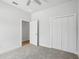 Bedroom boasts soft carpeting and a closet at 718 Desert Hills Way, Sun City Center, FL 33573