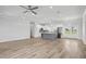 Expansive living room and modern kitchen with an island create an ideal space for entertaining at 718 Desert Hills Way, Sun City Center, FL 33573