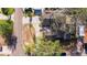 Overhead aerial view of a property featuring a well-maintained roof, a brick driveway, and a serene setting at 8296 33Rd N Ave, St Petersburg, FL 33710
