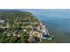 Panoramic aerial view of a charming, tree-lined neighborhood on the water, close to the city at 8296 33Rd N Ave, St Petersburg, FL 33710