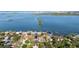 An aerial view showing the house's location in a waterfront community with various amenities and stunning bay views at 8296 33Rd N Ave, St Petersburg, FL 33710