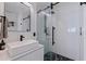 Modern bathroom with floating vanity, a vessel sink, and a glass shower with black trim at 8296 33Rd N Ave, St Petersburg, FL 33710