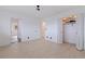 An airy bedroom featuring a closet, a door leading to another room, and a light wood floor at 8296 33Rd N Ave, St Petersburg, FL 33710