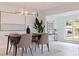 Dining room with modern lighting and art leads to an outdoor deck area and is perfect for entertaining at 8296 33Rd N Ave, St Petersburg, FL 33710