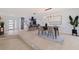 Open concept dining area with modern chandelier and easy access to the kitchen, perfect for entertaining at 8296 33Rd N Ave, St Petersburg, FL 33710