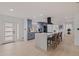 Spacious kitchen with gray cabinets, a central island with seating, and modern stainless steel appliances at 8296 33Rd N Ave, St Petersburg, FL 33710