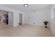 Open concept living space with kitchen, bathroom, a large window, and a light wood floor at 8296 33Rd N Ave, St Petersburg, FL 33710