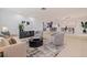 Inviting living space featuring a large round coffee table, an open concept, and light hardwood floors at 8296 33Rd N Ave, St Petersburg, FL 33710
