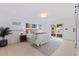 Bright main bedroom with outside access to deck and a neutral color scheme is perfect for a relaxing retreat at 8296 33Rd N Ave, St Petersburg, FL 33710