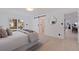 Comfortable main bedroom with en suite bathroom and a sliding barn door to the walk in closet at 8296 33Rd N Ave, St Petersburg, FL 33710