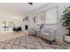 Cozy sitting area with a decorative fireplace and large windows allowing for plenty of natural light at 8296 33Rd N Ave, St Petersburg, FL 33710