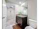 Bathroom with a stylish vanity, mirror, and tile flooring, offering a clean and modern look at 841 Royal Empress Dr, Ruskin, FL 33570