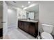 Bathroom featuring a double vanity, tile floors, and a toilet at 841 Royal Empress Dr, Ruskin, FL 33570