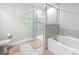 Clean bathroom features a glass-enclosed shower and a separate soaking tub at 841 Royal Empress Dr, Ruskin, FL 33570