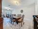 Inviting dining area featuring an elegant table set, seamlessly connecting to a comfortable living space at 841 Royal Empress Dr, Ruskin, FL 33570