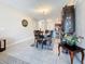 Open dining area with view into kitchen, featuring elegant dining set and stylish decor at 841 Royal Empress Dr, Ruskin, FL 33570
