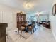 Spacious dining room features a china cabinet, a dining table with chairs, and access to the living room at 841 Royal Empress Dr, Ruskin, FL 33570
