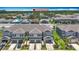 Aerial view of new townhomes with private driveways, a well-maintained lawn, and lush landscaping at 841 Royal Empress Dr, Ruskin, FL 33570