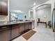 Open-concept kitchen featuring granite countertops, stainless steel appliances, and convenient access to the living area at 841 Royal Empress Dr, Ruskin, FL 33570