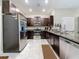 Modern kitchen featuring stainless steel appliances, granite countertops, and ample cabinet space at 841 Royal Empress Dr, Ruskin, FL 33570