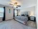 Spacious main bedroom with a decorative ceiling fan and large windows at 841 Royal Empress Dr, Ruskin, FL 33570