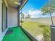 View from the covered patio looking out to a well-maintained, fenced backyard at 841 Royal Empress Dr, Ruskin, FL 33570