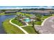 Aerial view of community pool with surrounding walkways, lawns, and adjacent buildings at 841 Royal Empress Dr, Ruskin, FL 33570