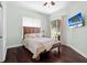 Serene bedroom with hardwood floors, sliding glass door, and plenty of natural light at 9075 Waterash N Ln, Pinellas Park, FL 33782