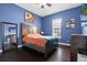 Bright bedroom with hardwood floors, colorful accents, and ample natural light at 9075 Waterash N Ln, Pinellas Park, FL 33782