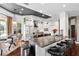 Bright kitchen with stainless steel appliances, island, breakfast bar, and adjacent breakfast nook at 9075 Waterash N Ln, Pinellas Park, FL 33782
