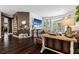 Spacious living room with dark wood floors, designer decor, and large windows for natural light at 9075 Waterash N Ln, Pinellas Park, FL 33782
