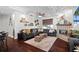 Comfortable living room with fireplace, ceiling fan, and an open layout at 9075 Waterash N Ln, Pinellas Park, FL 33782