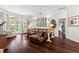 Open concept living space featuring hardwood floors and views of the backyard at 9075 Waterash N Ln, Pinellas Park, FL 33782