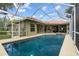 Backyard pool and outdoor space surrounded by lush landscaping at 9075 Waterash N Ln, Pinellas Park, FL 33782