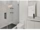 Bathroom featuring a glass enclosed shower with hexagon tile floor and vanity with sink at 908 W Fribley St, Tampa, FL 33603
