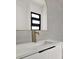 Bathroom featuring modern sink with gold faucet at 908 W Fribley St, Tampa, FL 33603