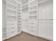 Walk-in closet featuring custom shelving and drawers at 908 W Fribley St, Tampa, FL 33603