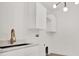 Laundry Room with sink, overhead cabinets, and modern faucet at 908 W Fribley St, Tampa, FL 33603