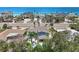 Aerial view of a home with a backyard pool, set against a backdrop of ocean views and tropical foliage at 931 Gulf Blvd, Belleair Beach, FL 33786