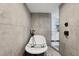 The bathroom offers a sleek freestanding tub, modern shower, and is finished with beautiful gray tile work at 931 Gulf Blvd, Belleair Beach, FL 33786