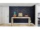 Stylish entryway features a modern console table, unique wall decor, and a clean, minimalist aesthetic at 931 Gulf Blvd, Belleair Beach, FL 33786