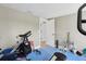 The home gym comes complete with various exercise machines and free weights for a complete workout space at 931 Gulf Blvd, Belleair Beach, FL 33786