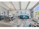 Bright and airy living room showcasing stylish furniture, a vaulted ceiling, and plenty of natural light at 931 Gulf Blvd, Belleair Beach, FL 33786