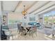 Stylish living area with an open floor plan, large windows, and a comfortable seating area at 931 Gulf Blvd, Belleair Beach, FL 33786